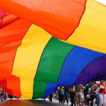 Rainbow flag banner at parade