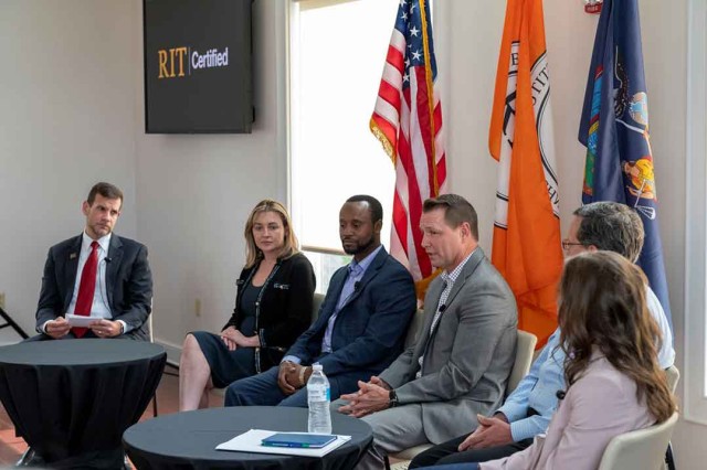 six people participating in a panel discussion.