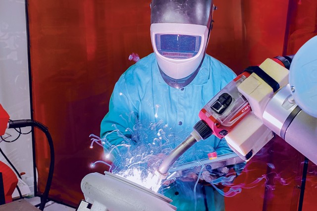 a person using next-generation welding equipment.