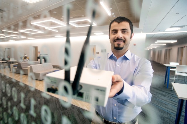 professor holding a router.