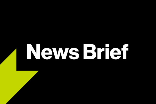 A graphic with a black background, a green ribbon graphic, and bold white text that reads, "News Brief". 