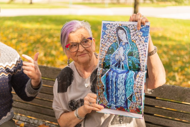 Melissa Skyer's mother Sally holds a photo of one of Melissa's mosaics