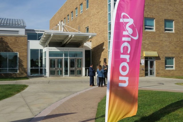 Brick building with a Micron flag out front. 