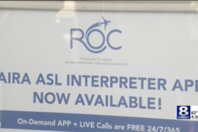 a sign advertising A S L interpreting at the Rochester airport.