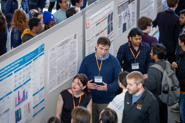 idney Grabosky, center, talks about how people might use smartwatches in the future at the RIT Graduate Showcase