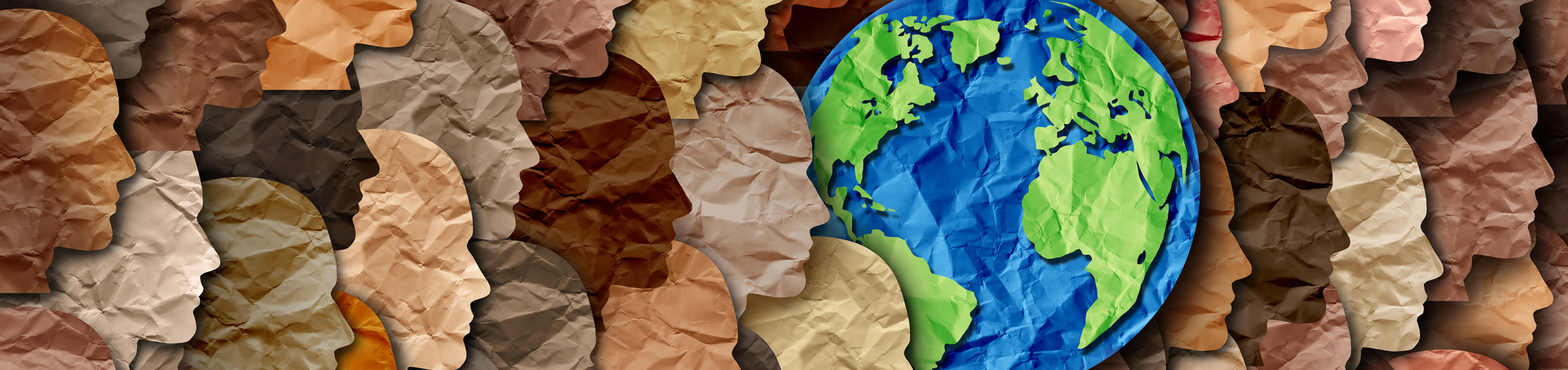 paper graphic of multi colored face profiles and blue and green earth globe
