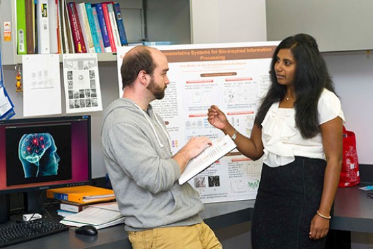 student and professor talking.