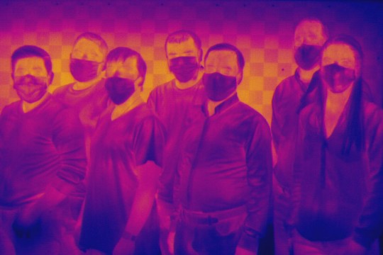 a thermal imaging photo of a team of researchers.