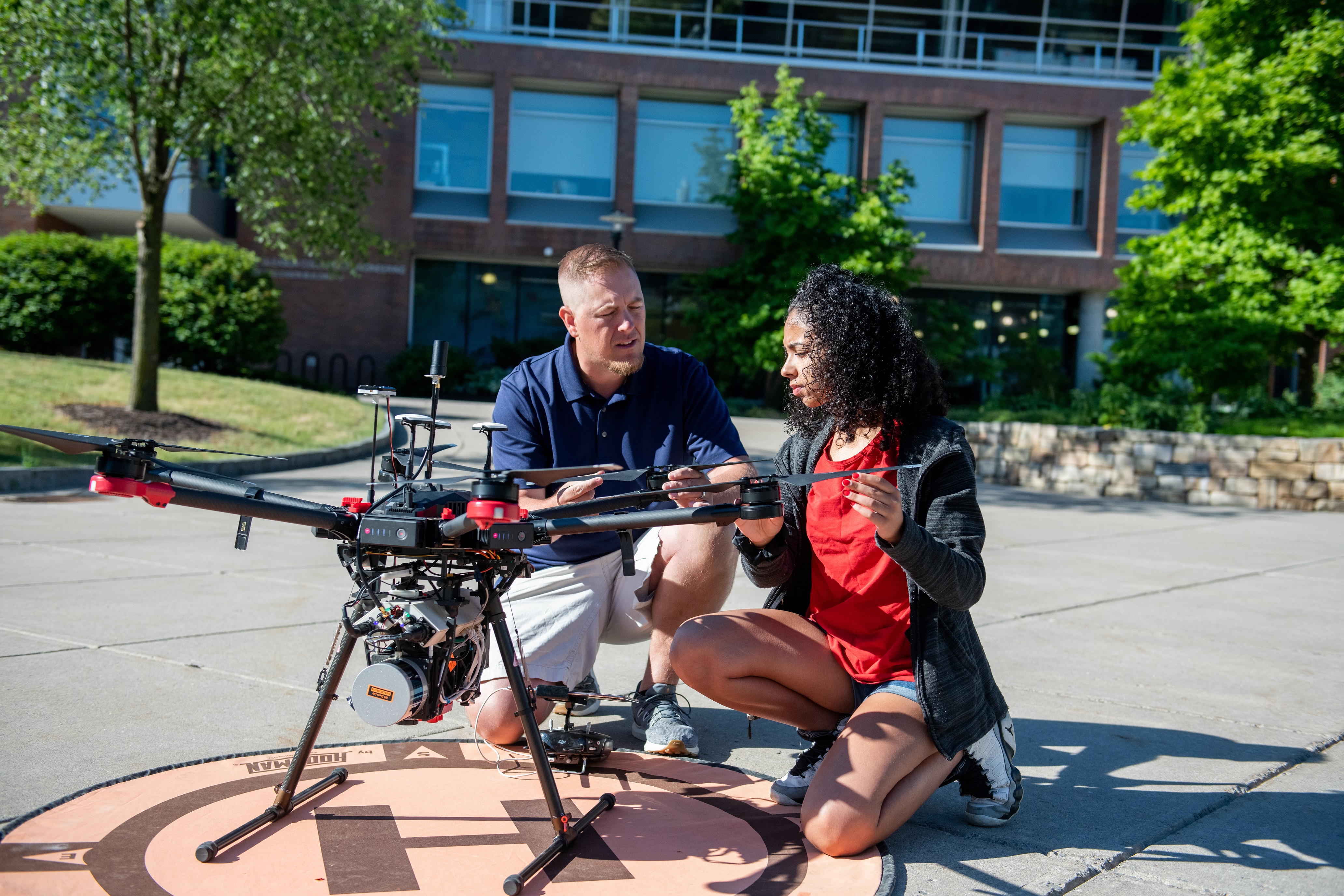 professor and student with drone