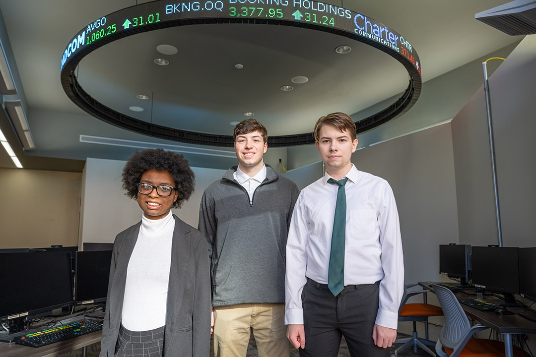 From left, Alexandria Walker, Evan Macko, and Carter Ptak made up an interdisciplinary team of RIT students that finished No. 1 in North America and third globally in the Bloomberg 2023 Global Trading Challenge.