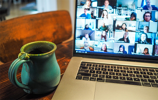 A laptop screen showing a zoom meeting.