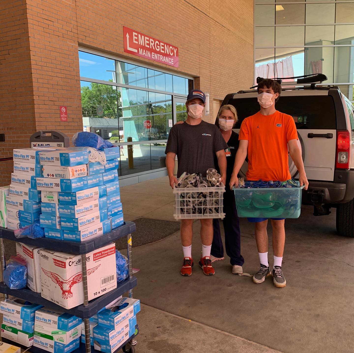 Image outside of hospital with supplies being donated