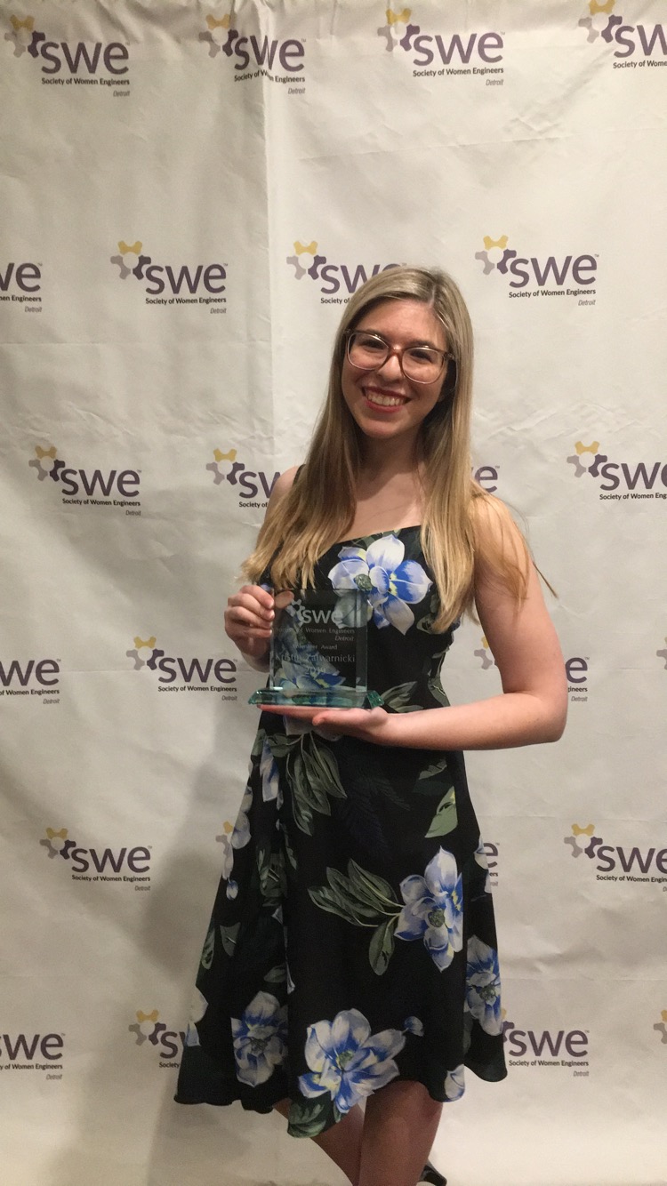 Kristin winning an award from Society of Women Engineers