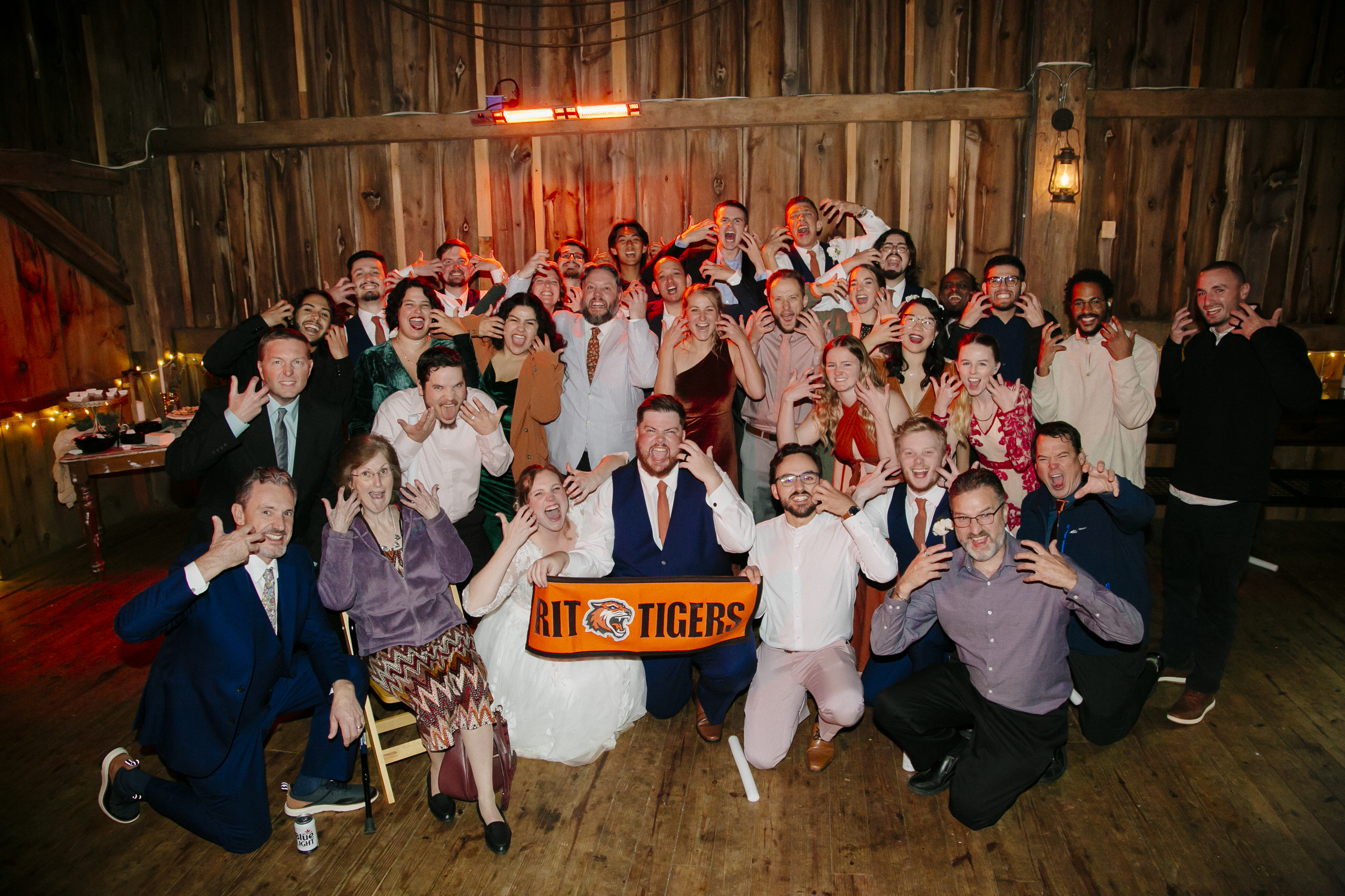 a group of people posing for a photo at a wedding