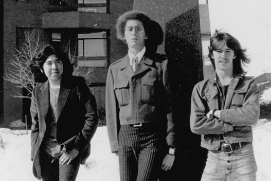 Three people posing for camera