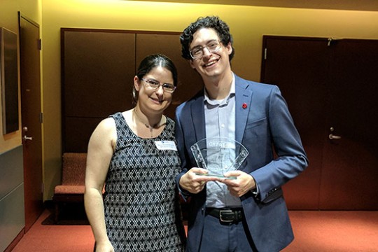 Two people posing for camera