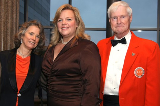 Three people posing together