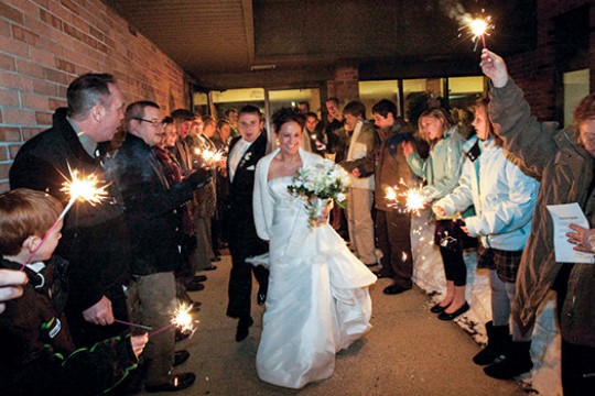 People gathered around couple getting married