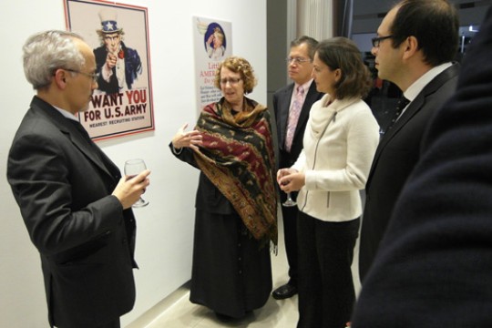 People gathered around propaganda art