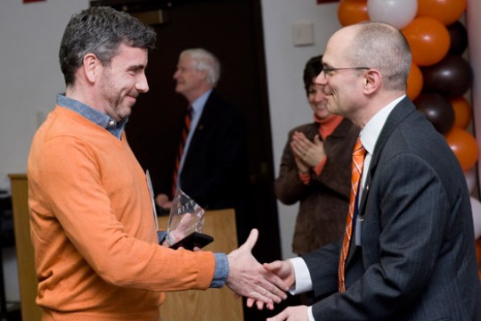 People shaking hands at event