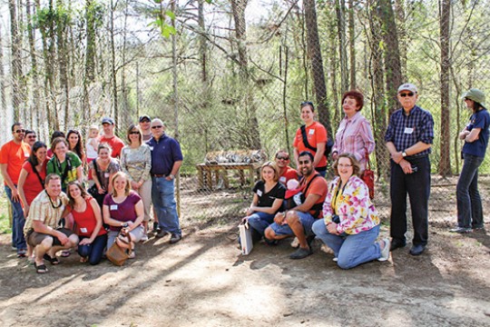 People posing at zoo