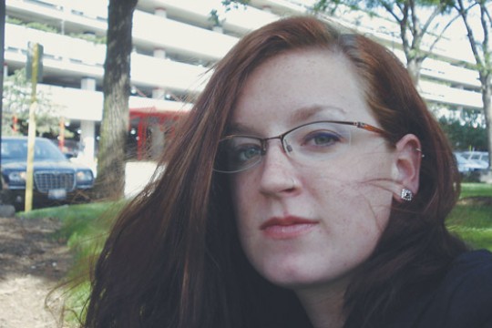 Person posing for camera outside