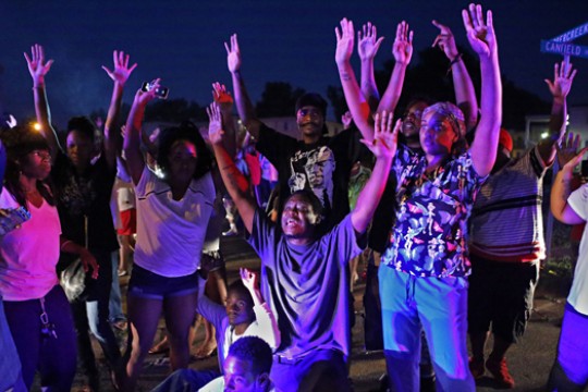 People raising there hands in fear