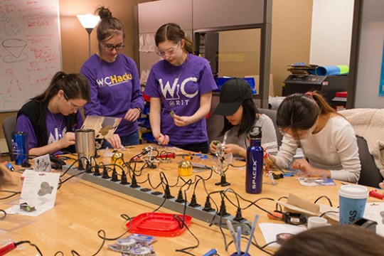 People working on experiment in classroom
