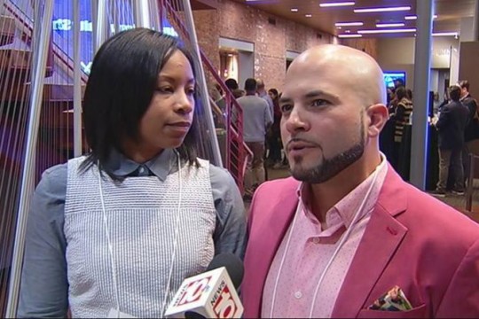 Couple talks to news reporter.