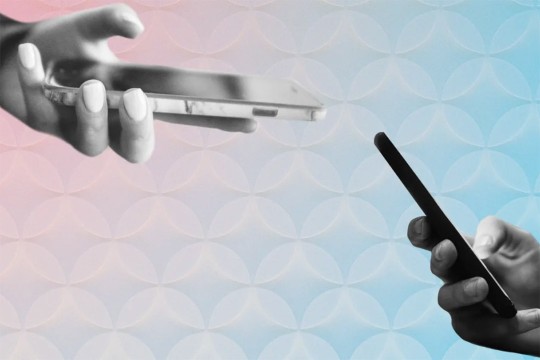 Two hands holding cellphones near each other.