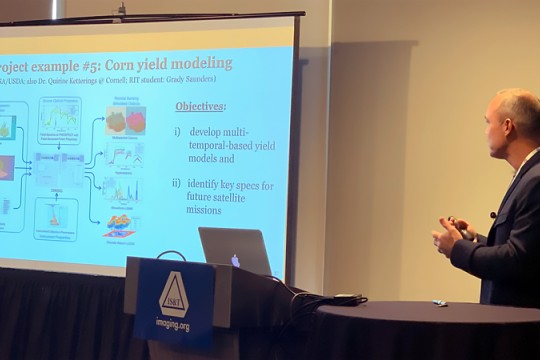 professor presenting at a conference