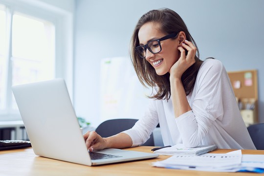 woman working on a laptop computer.