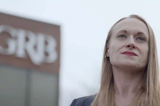 Megan Antonitto in front of Genesee Regional Bank