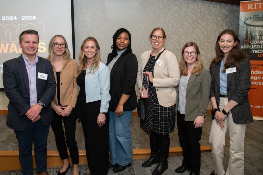 First american Equipment Finance alumni receiving award