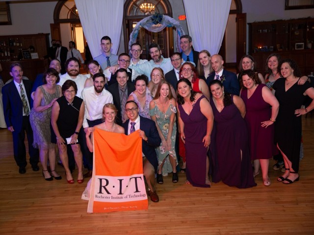 Couple surrounded by RIT Tiger Family (Alums and employees)