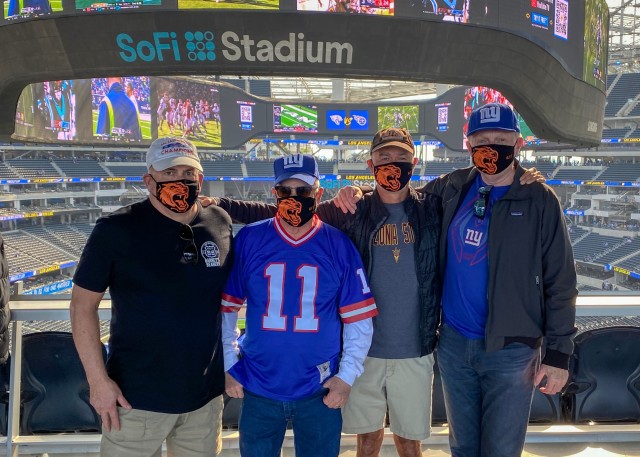 At SoFi Stadium on December 12, 2021, a group of alumni proudly wore their RIT masks while cheering on the New York Giants against the hometown Los Angeles Chargers. From left to right: Patrick Roche ’77, Greg Appel ’75, Dave Sheble ’78, Dean Reinmund ’76