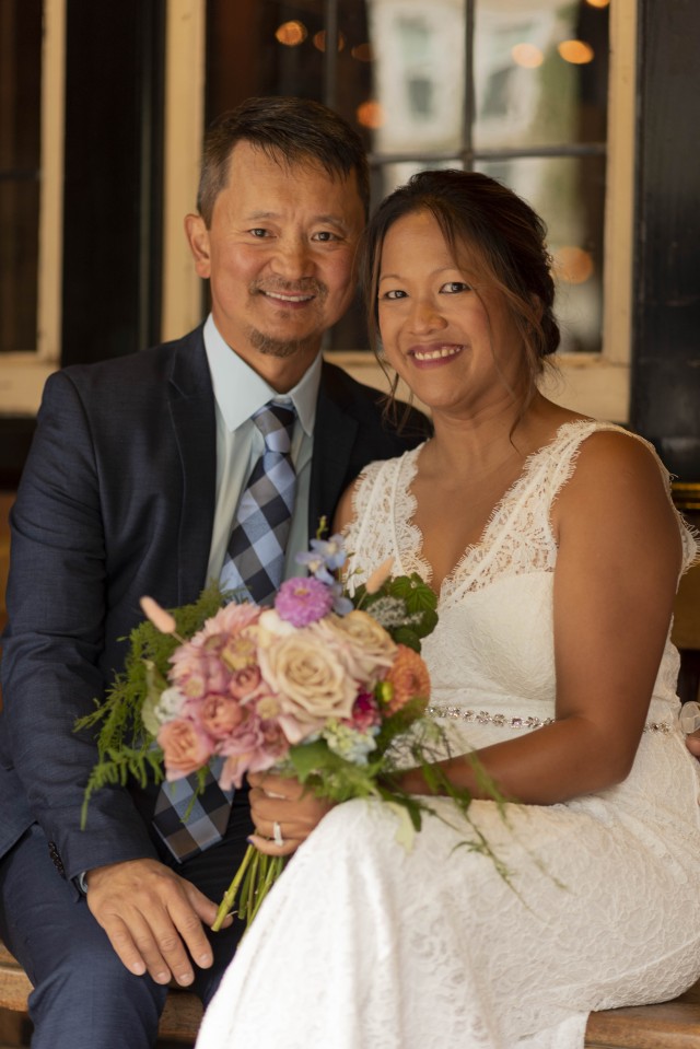 Jonathan and Joanne sitting on the bench at the Good Luck Restaurant.