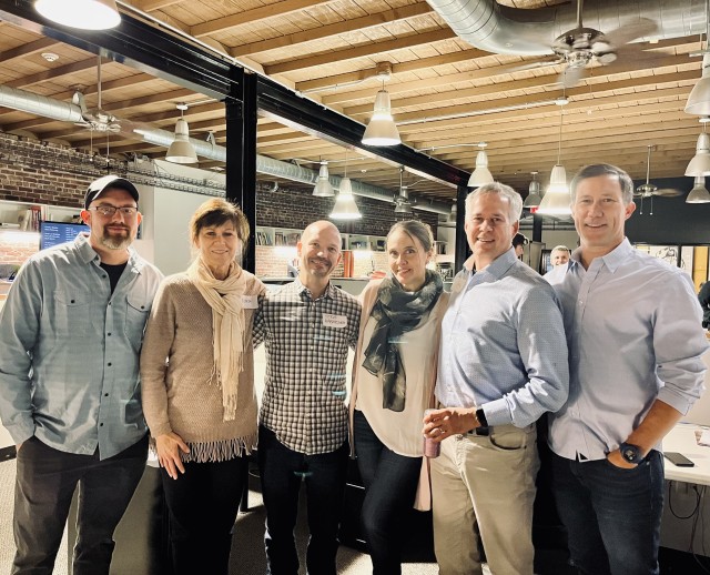 Dan and Nora with current and past Taylor Design employees at the firm’s 30th anniversary party on December 1. Nora second from left. Dan fifth from left.