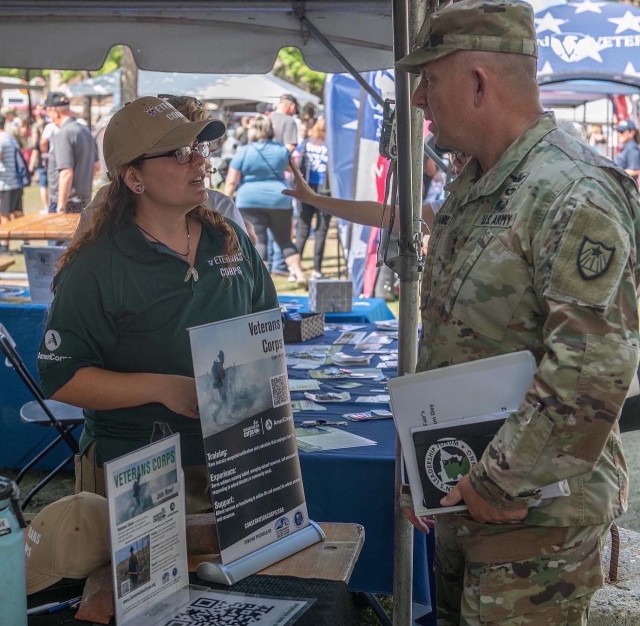 Grace Anne working Veterans info booth at MN State Fair on Veterans Day