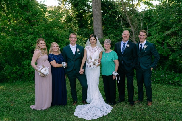 Photo of 5 RIT alumni celebrating a marriage.