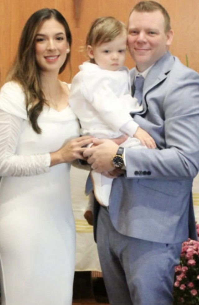 Jessica Portilla‑Mulvaney ’12 (CCE) and Michael Mulvaney with their son, Michael Hunter, at his baptism