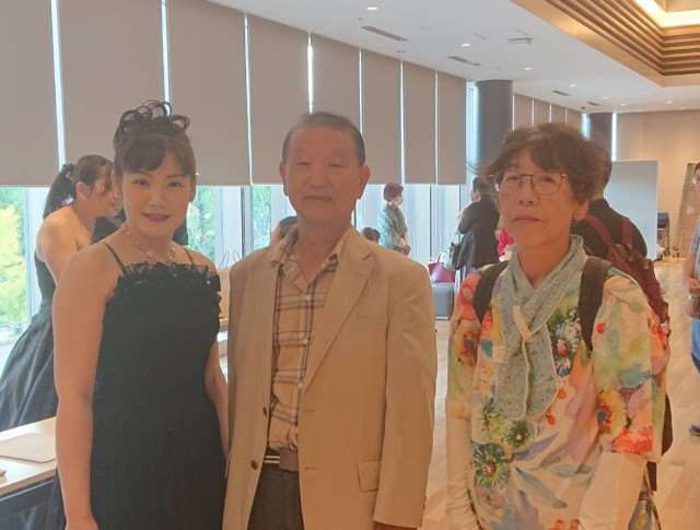 Ms. Aiko Miyai and Mr. and Mrs Takeuchi at the concert hall.