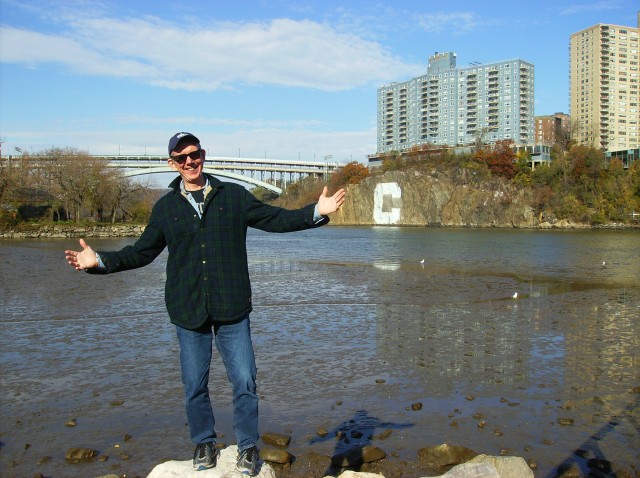 Gerard Kiernan standing at the tip of Manhattan with Columbia Rock in the background