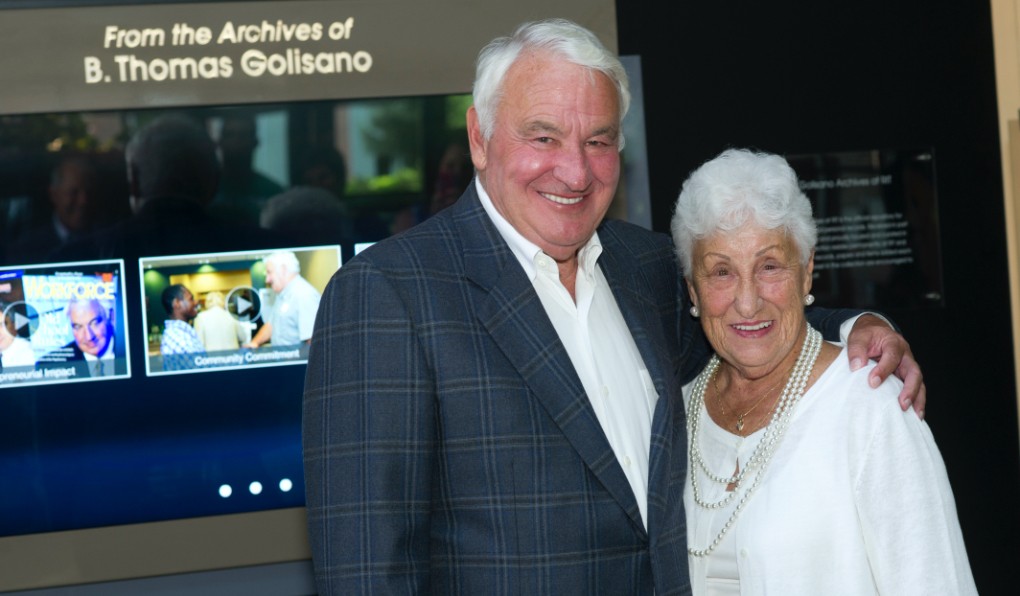 Tom Golisano standing with a woman wearing white