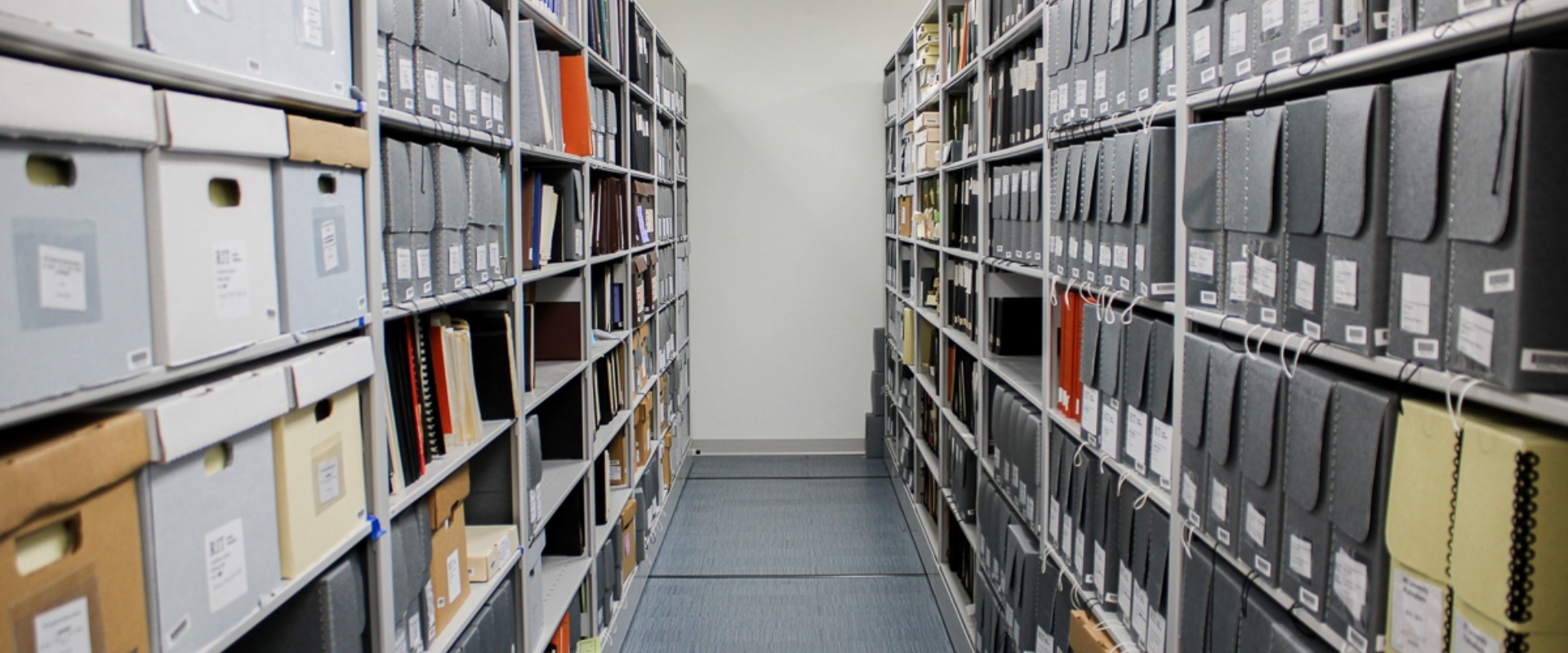 Archival items on shelf in RIT Archives