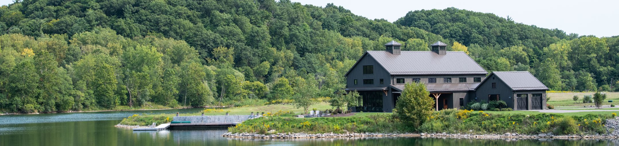 the Tait Preserve surrounded by a large body of water and hills