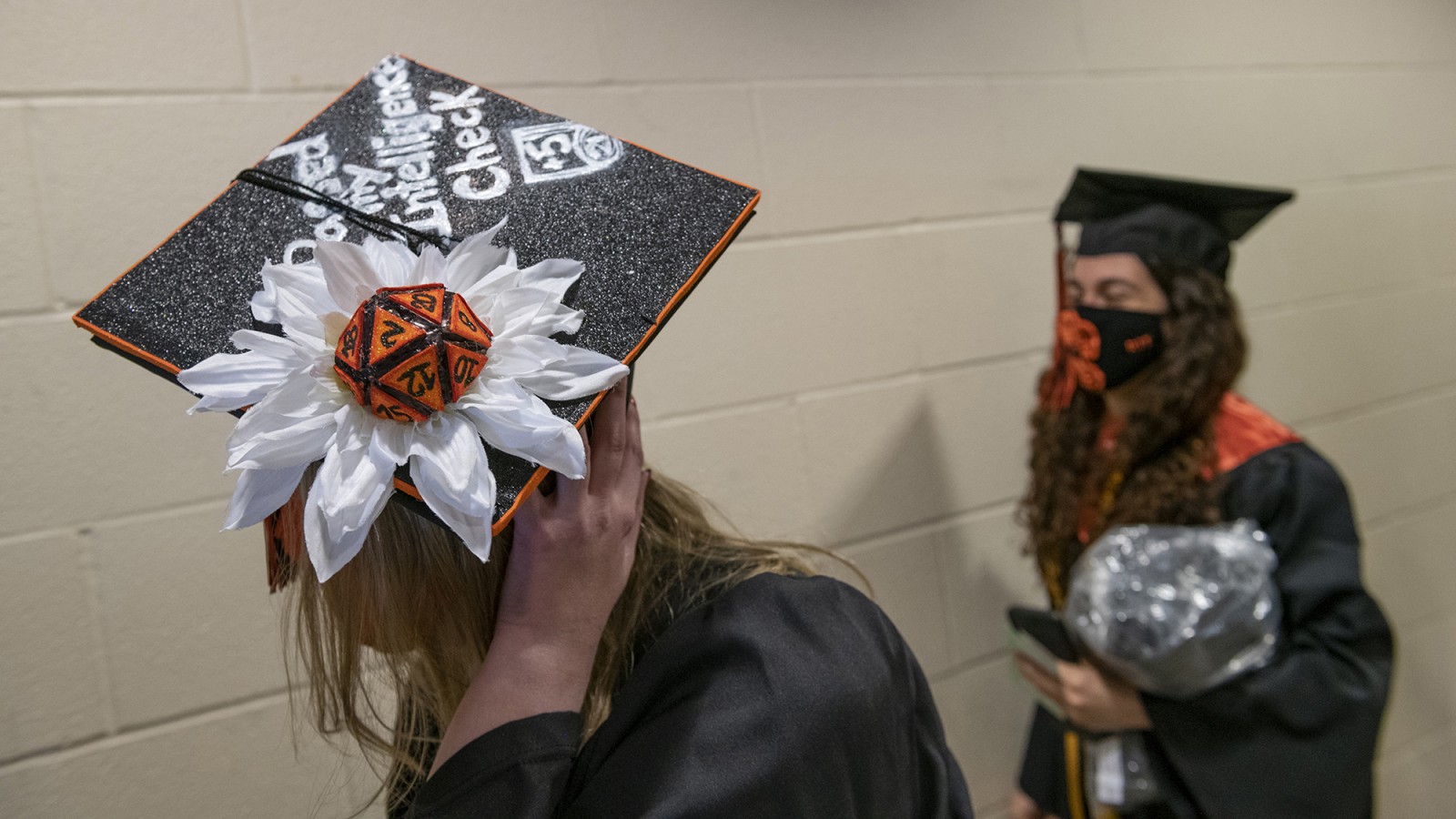 A grad cap with a small Rubic's Cube on it.