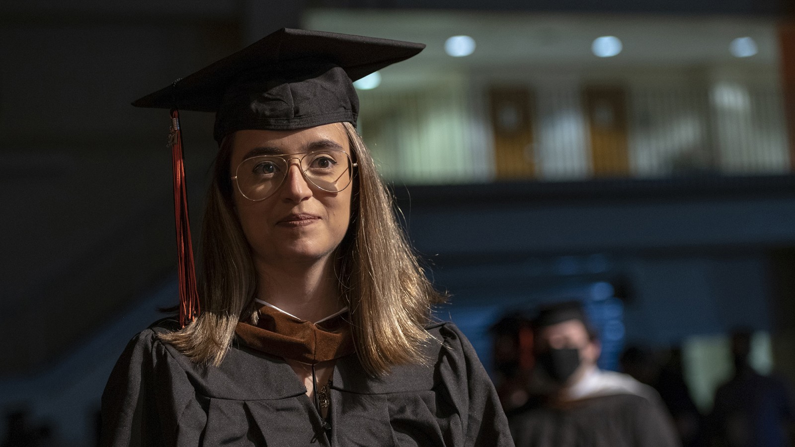 A photo of grad candidate Tati Ferrucio in regalia.