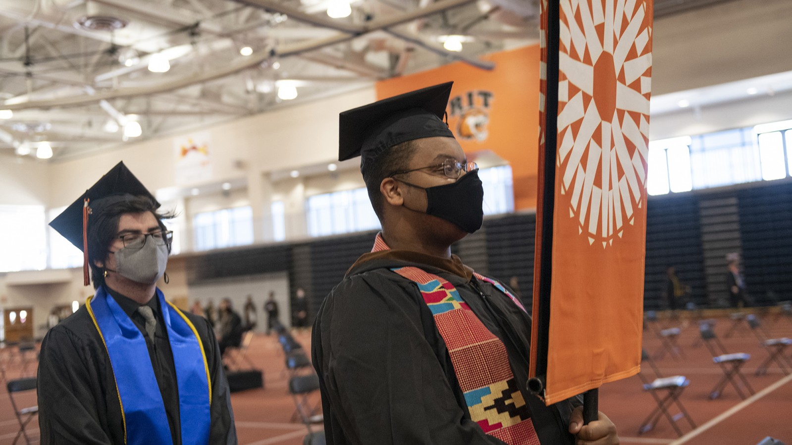 Delegates Unique Fair and Matty Feric stand next to each other in line.