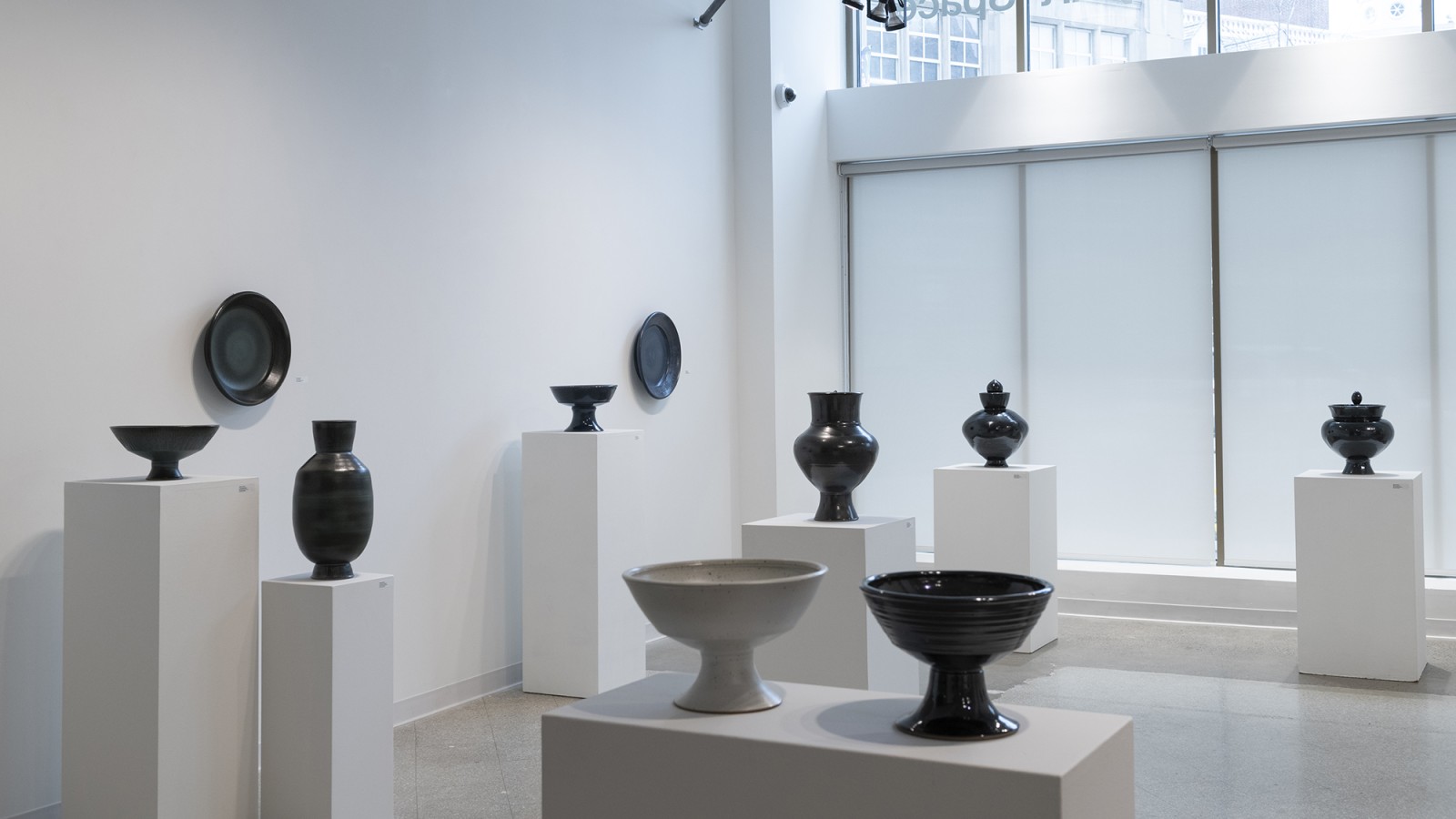 A display of a collection of utilitarian vessels.